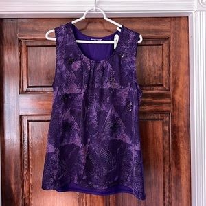 Purple sleeveless top with sequins.   Solid purple on the back.  Used. XL